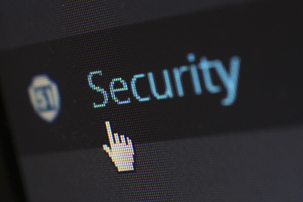 The word 'Security' appears in blue as a mouse pointer hovers nearby about to click the link.